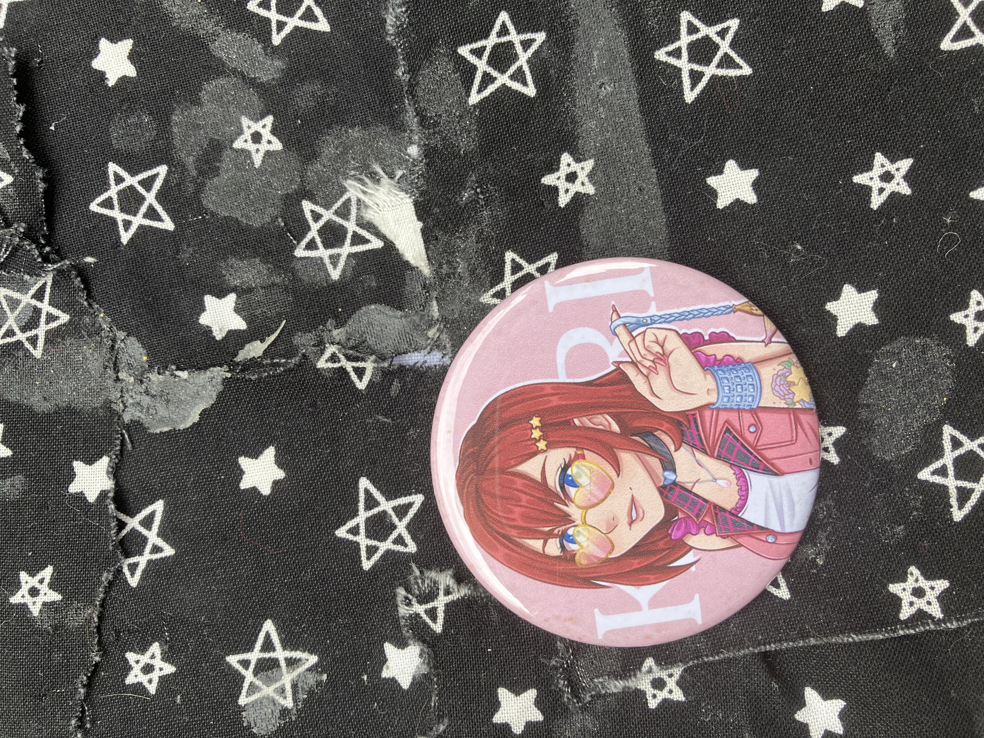 Button of Kingdom Hearts hipster styled Kairi with glasses, tattoos and holding her lucky charm.